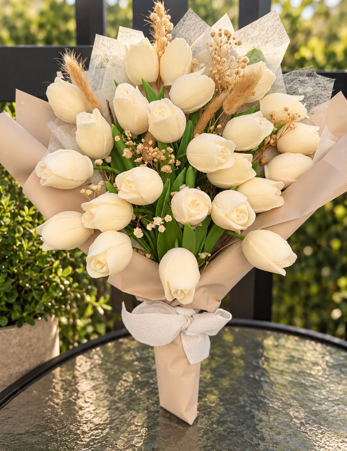 Wrapped bouquet of white wax tulips by Missy Sol