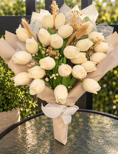 Wrapped bouquet of white wax tulips by Missy Sol
