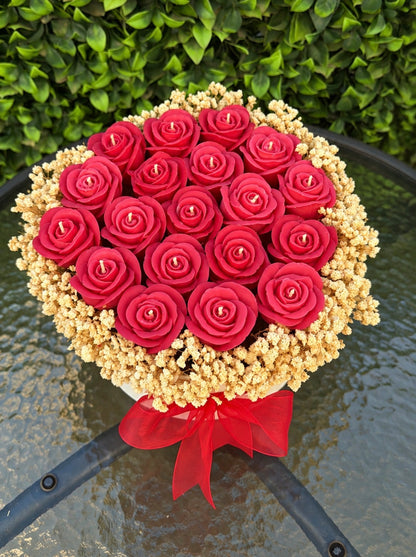 Wrapped bouquet of red wax roses with baby's breath by Missy Sol