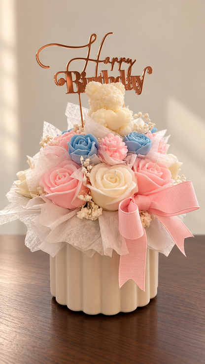 Pastel wax flower birthday arrangement with Happy Birthday topper and teddy bear by Missy Sol
