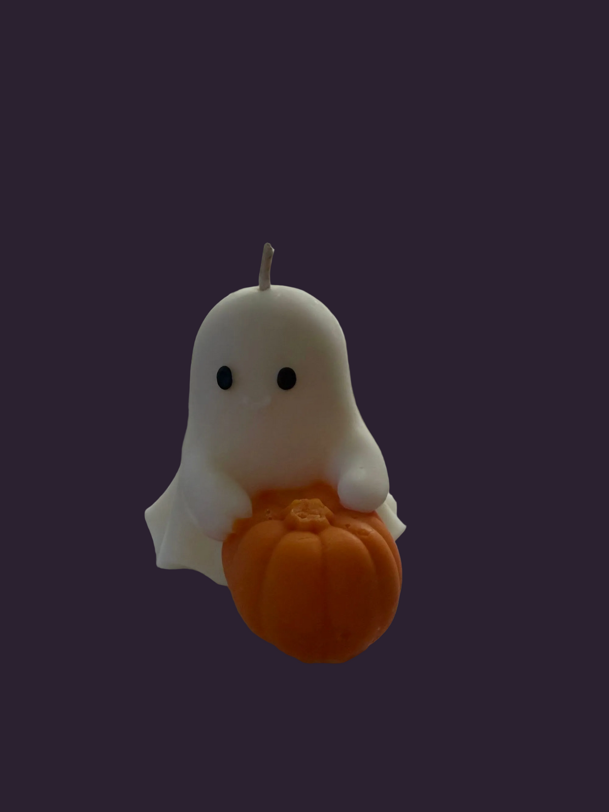 Ghost holding a pumpkin hand-poured soy candle by Missy Sol, caramelised toffee apple scent