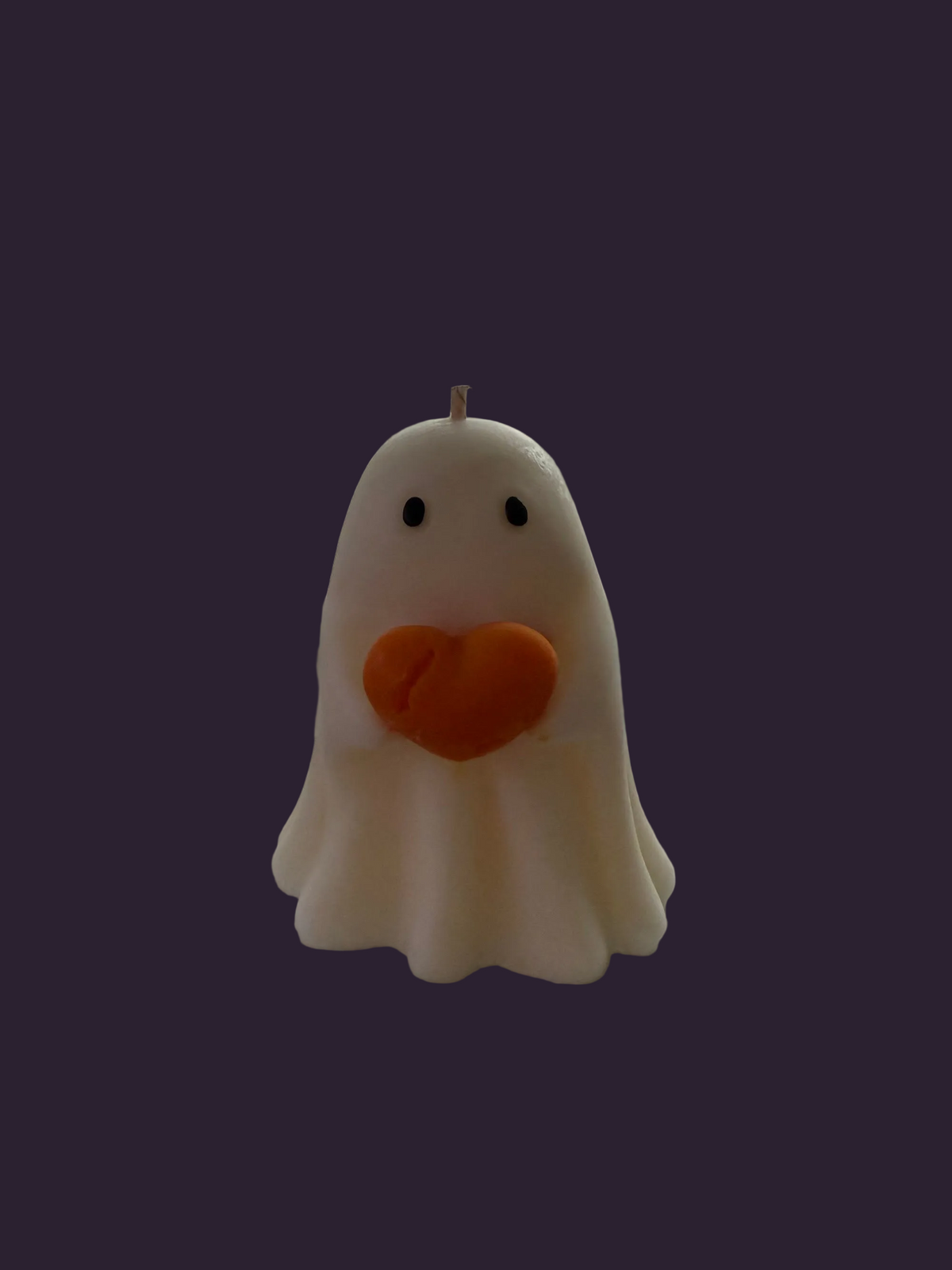 Ghost holding an orange heart, hand-poured soy candle by Missy Sol, caramelised toffee apple scent