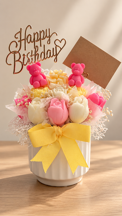 Pink and yellow wax tulip birthday arrangement with Happy Birthday topper, teddy bears and gift tag by Missy Sol
